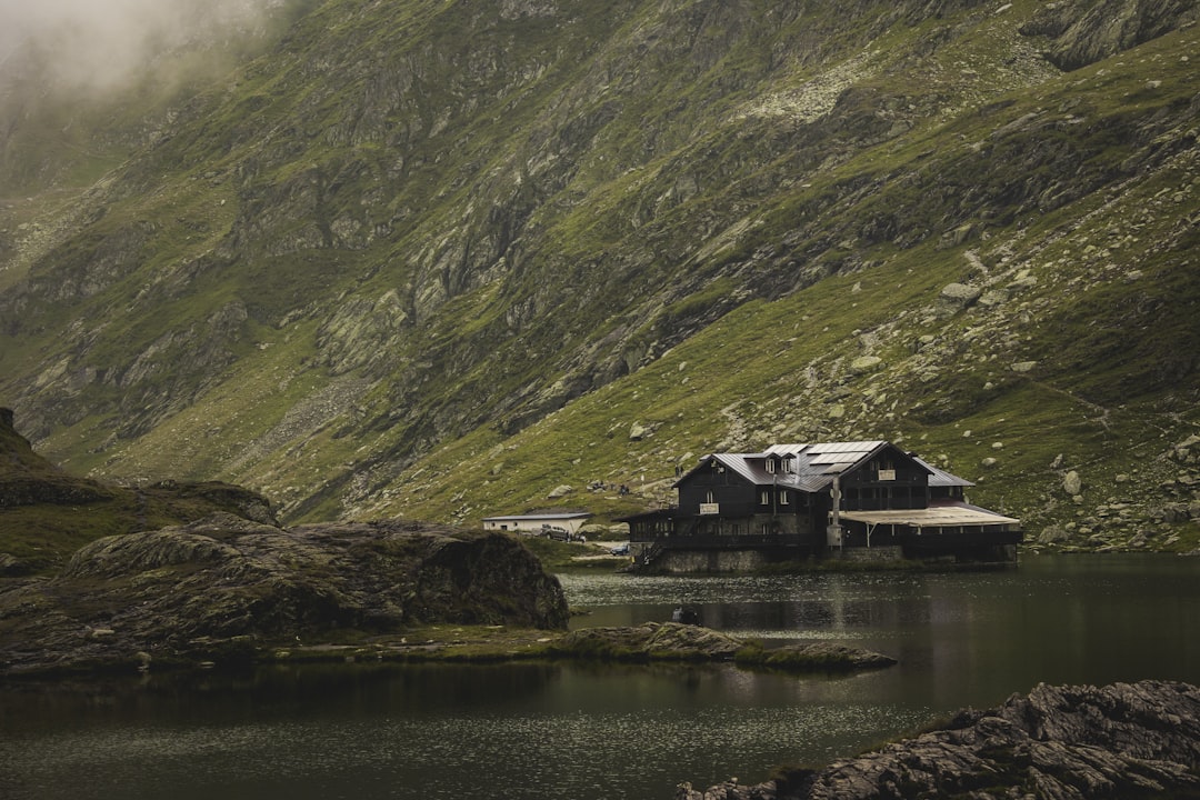 Balea Lake Romania frozen ice Fagaras Mountains background