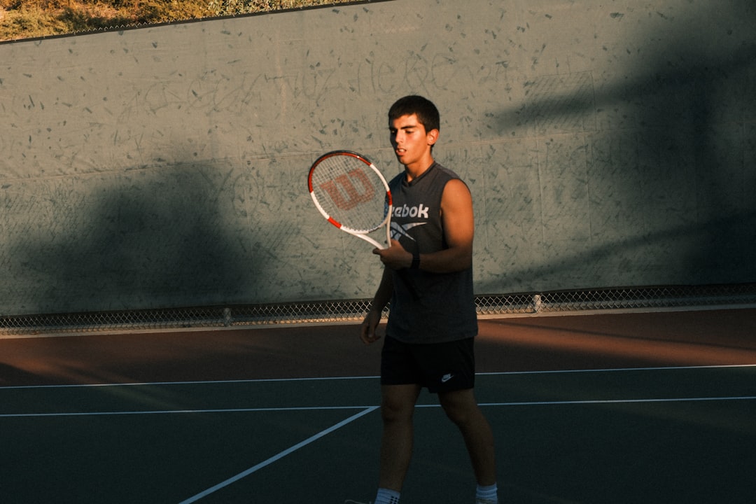 Novak Djokovic celebrating tennis victory trophy