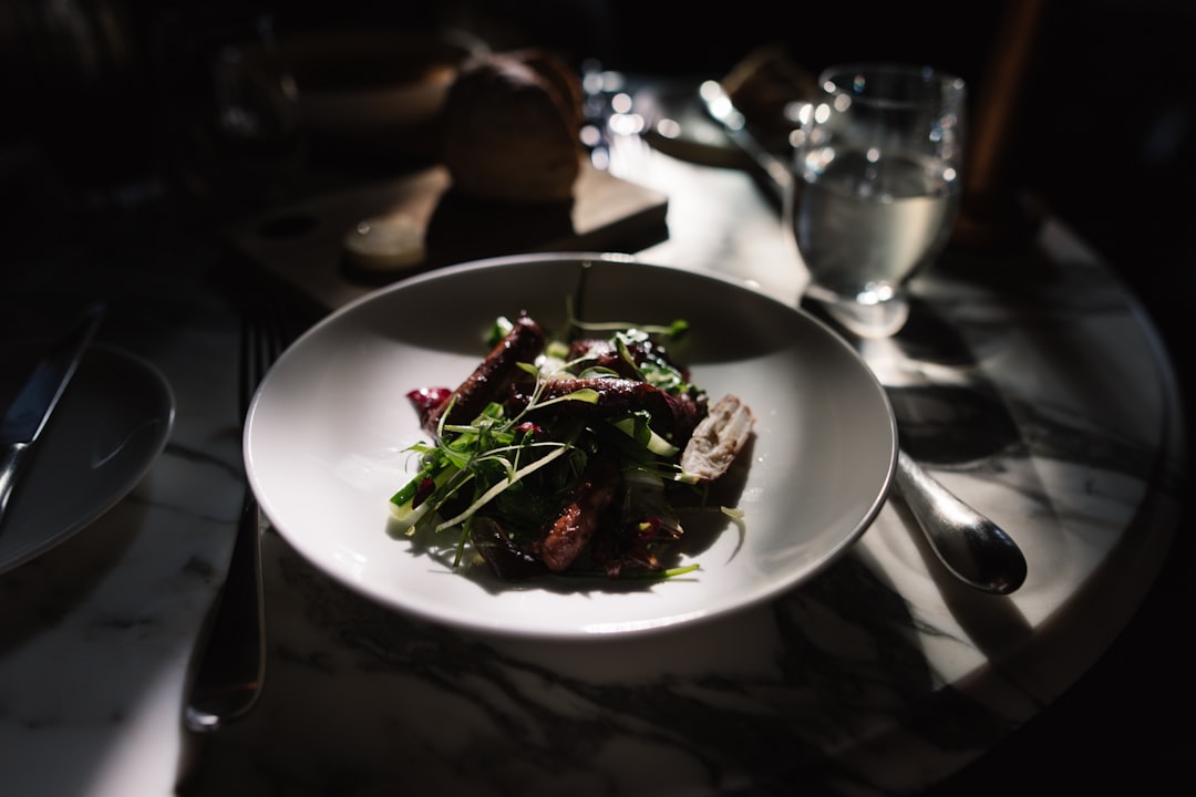 Serbian roasted pork potato salad restaurant table