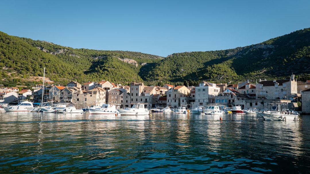 Komiža harbor Croatia wooden fishing boats morning light