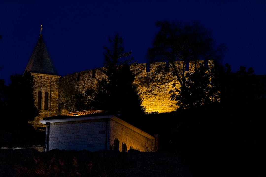 Studenica Monastery night exterior moonlight stone walls quiet atmosphere