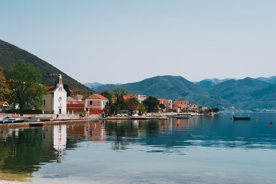 Mošćena village Montenegro traditional houses river bank evening