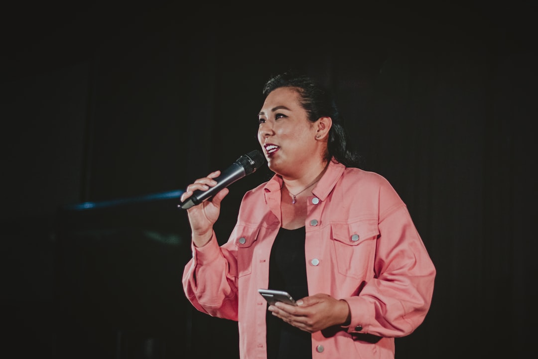Aleyna Tilki performing on stage with microphone