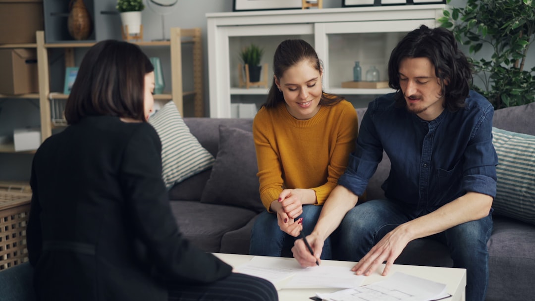 Greek family reviewing mortgage documents table