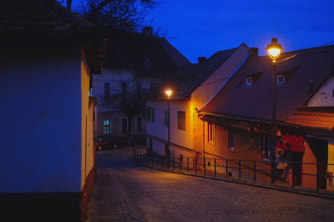 Sibiu nightlife bars cobblestone streets evening