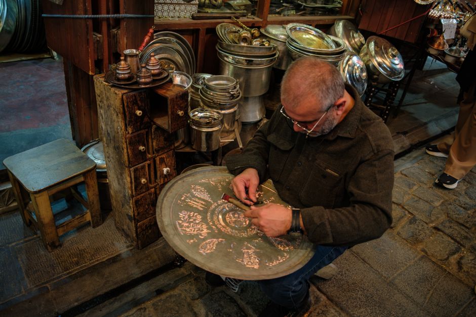 Narrow alley Prizren old bazaar artisan workshop copper pots leather goods