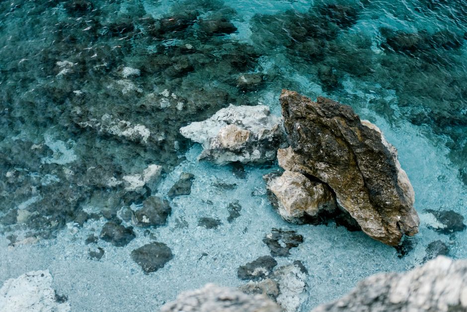 Prahcanica Beach Montenegro crowded rocky shore deep blue water
