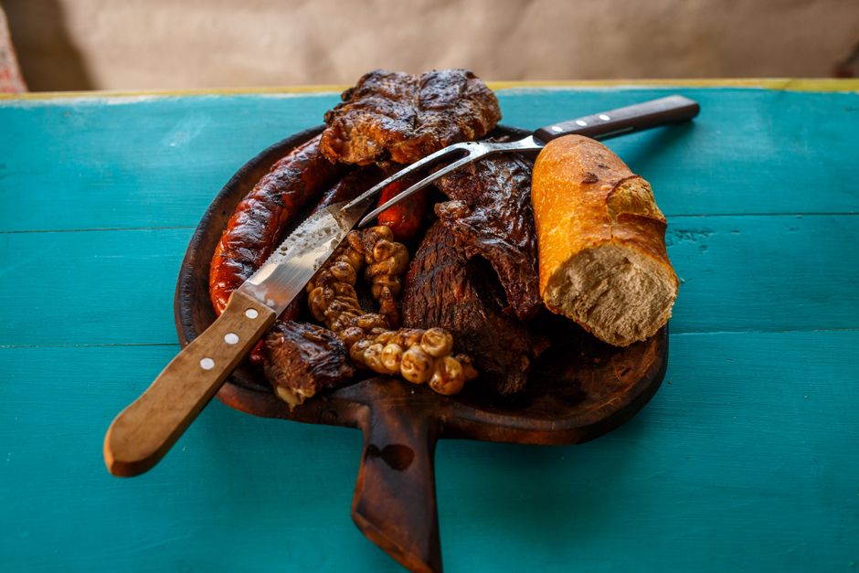 Serbian traditional restaurant Ivanjica wooden tables grilled meat platter