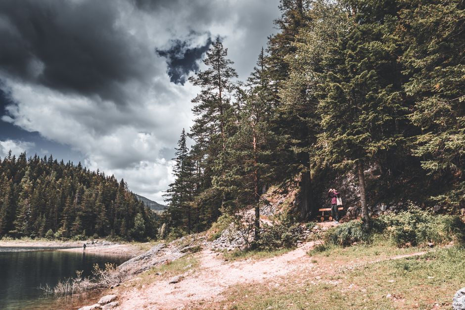 Hikers on Black Lake Loop trail Durmitor Montenegro rocky path forest