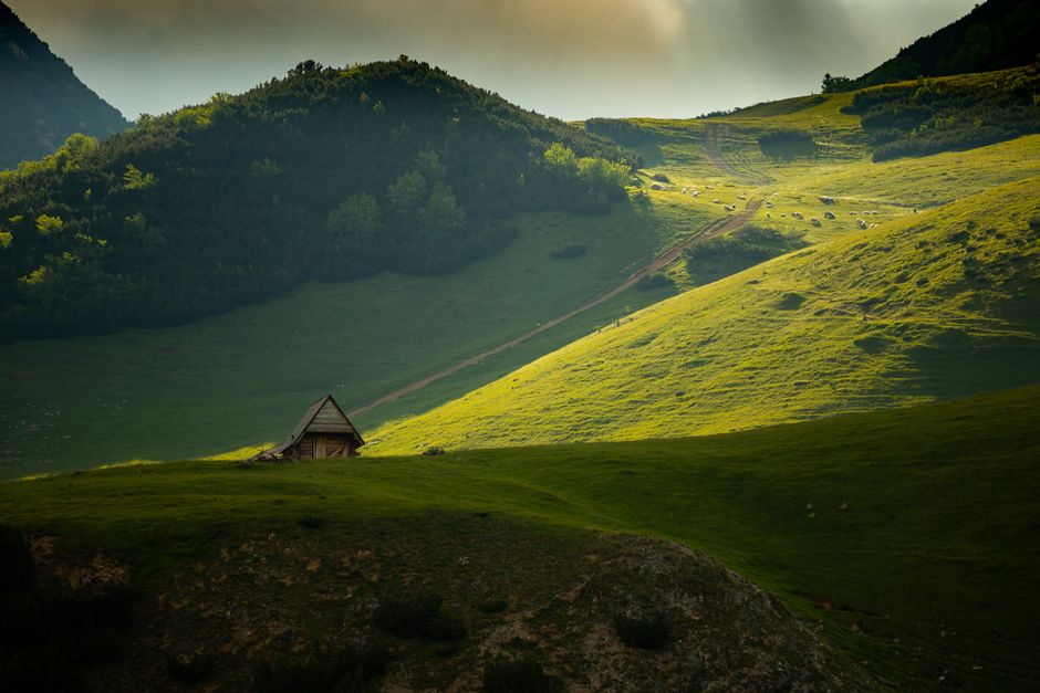 Rila Mountains Bulgaria traditional stone katun hut alpine pasture sunset