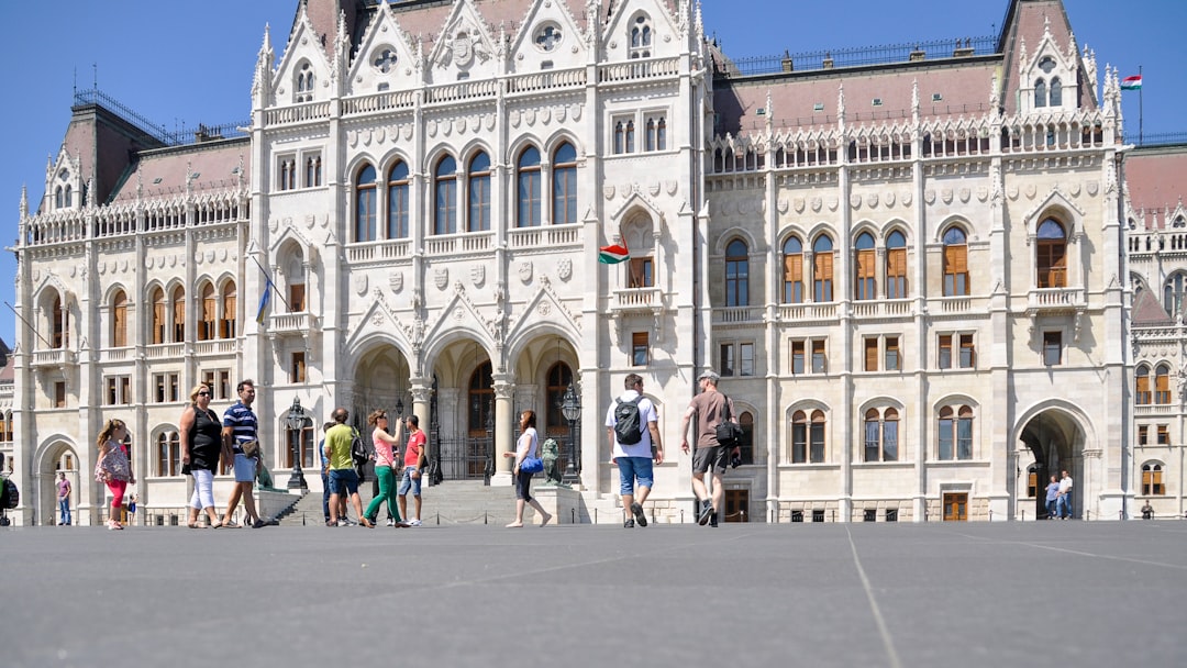 Protesters holding signs outside Hungarian government building