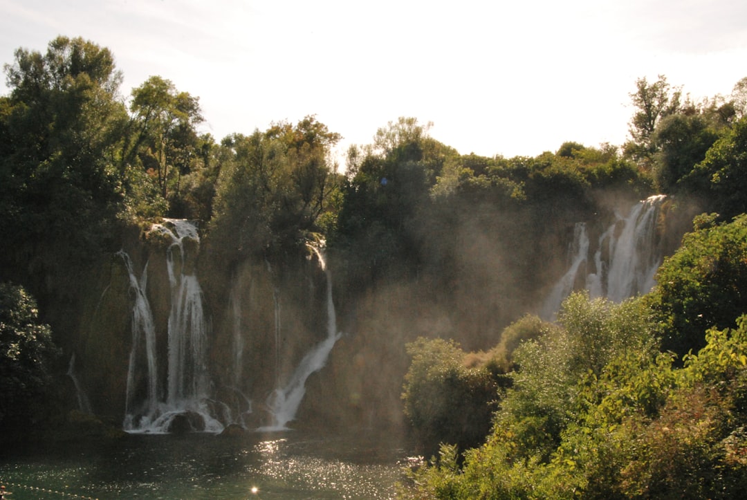 Veliki Slap waterfall Bosnia mist rainbow wooden boardwalk