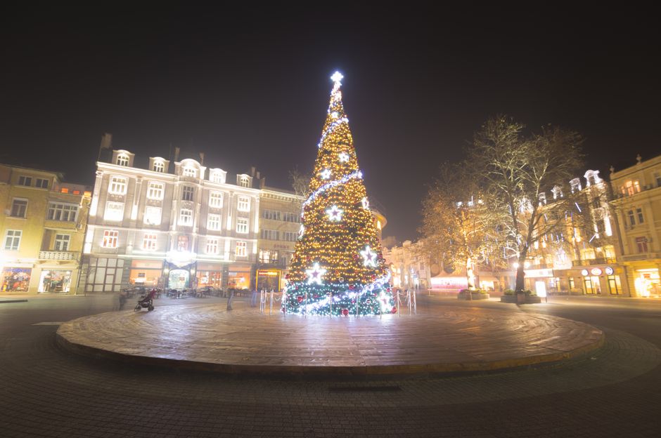 Bansko Bulgaria town square evening lights mountain backdrop
