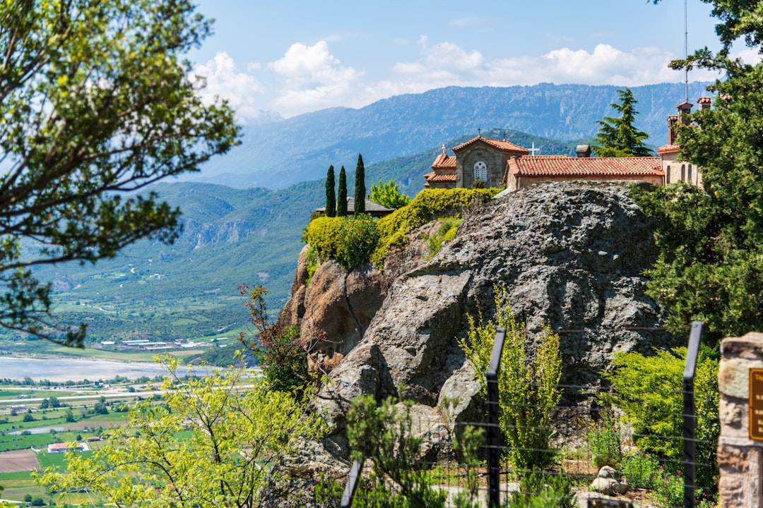 Great Meteoron Monastery Meteora Greece stone steps cliff edge morning light