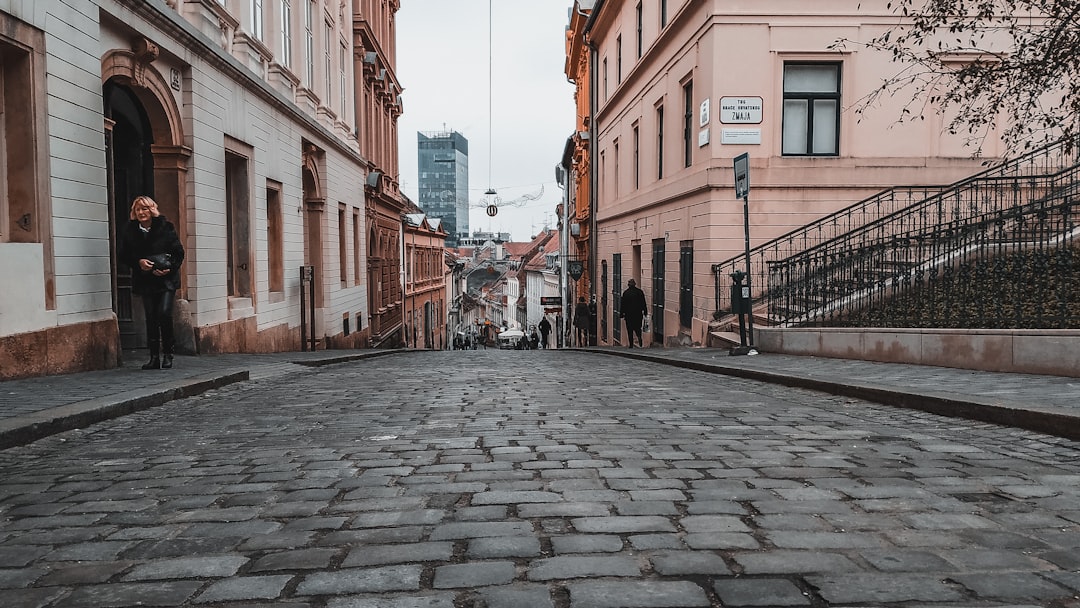 Zagreb skyline tram tracks cobblestones morning light