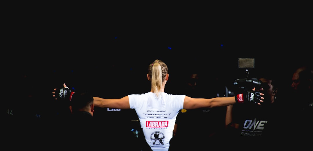 Valentina Shevchenko celebrating victory UFC 250 octagon