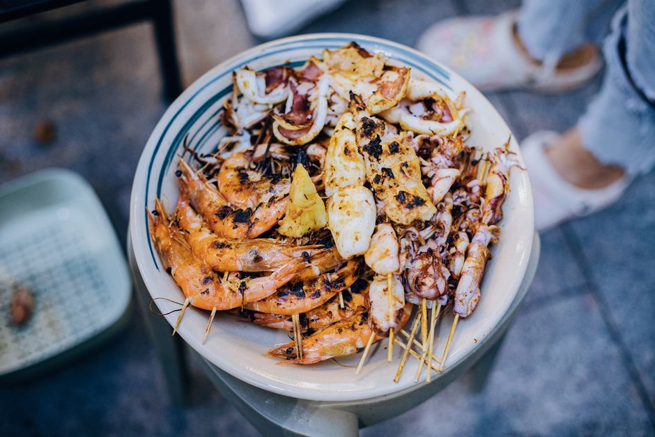 Grilled seafood platter Perast Montenegro outdoor restaurant evening