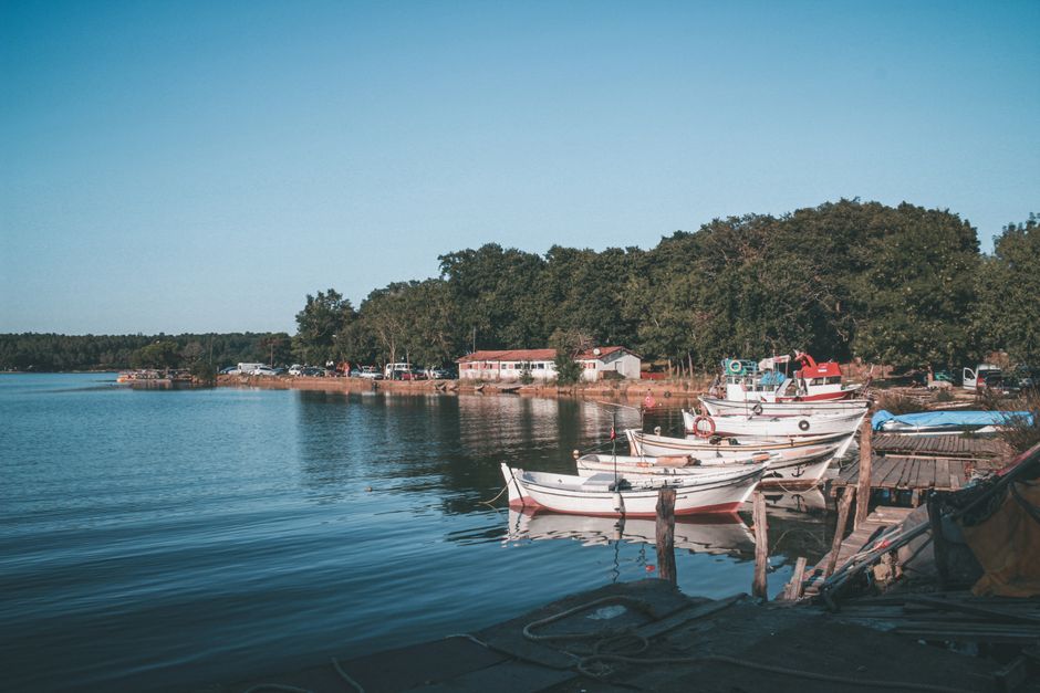 Kurina Albania fishing pier wooden boats traditional houses