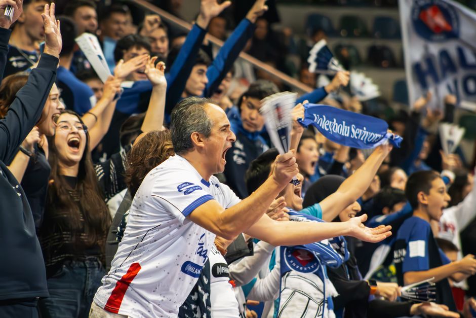 Volleyball match crowd cheering in Ankara sports arena