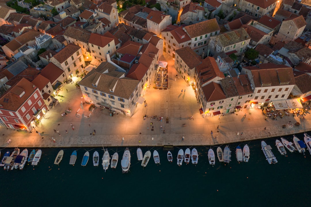 Carpe Diem club Hvar Town neon lights crowd dancing
