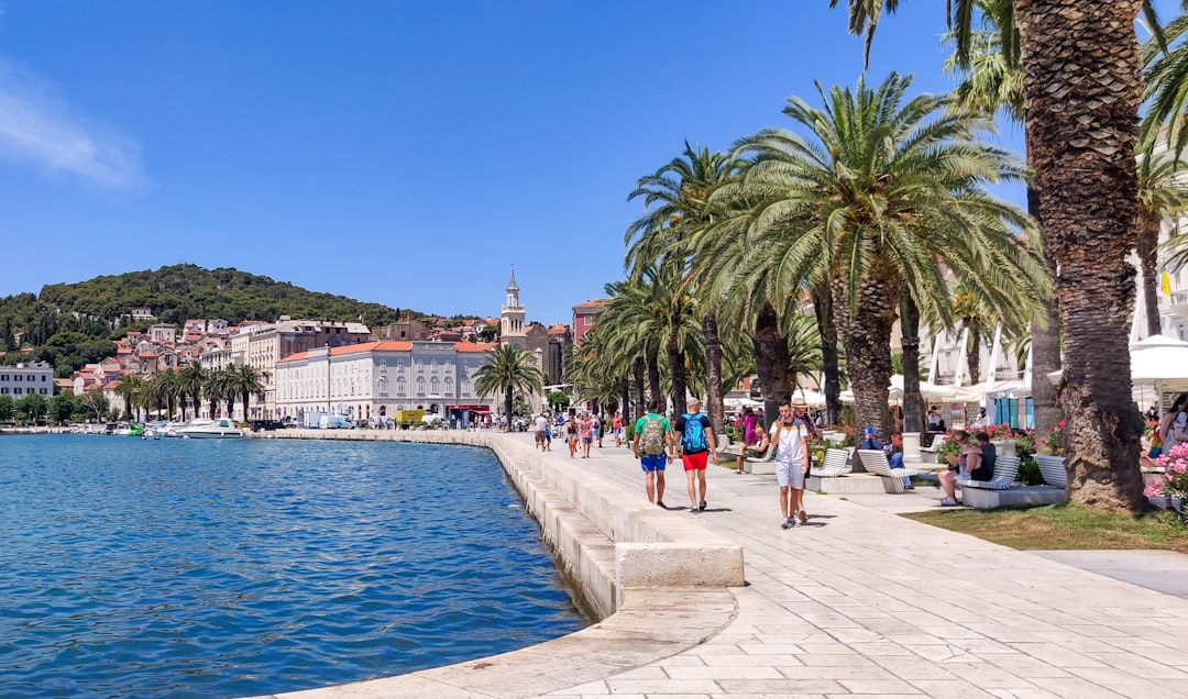 Split Croatia Riva waterfront night cafes lights reflection