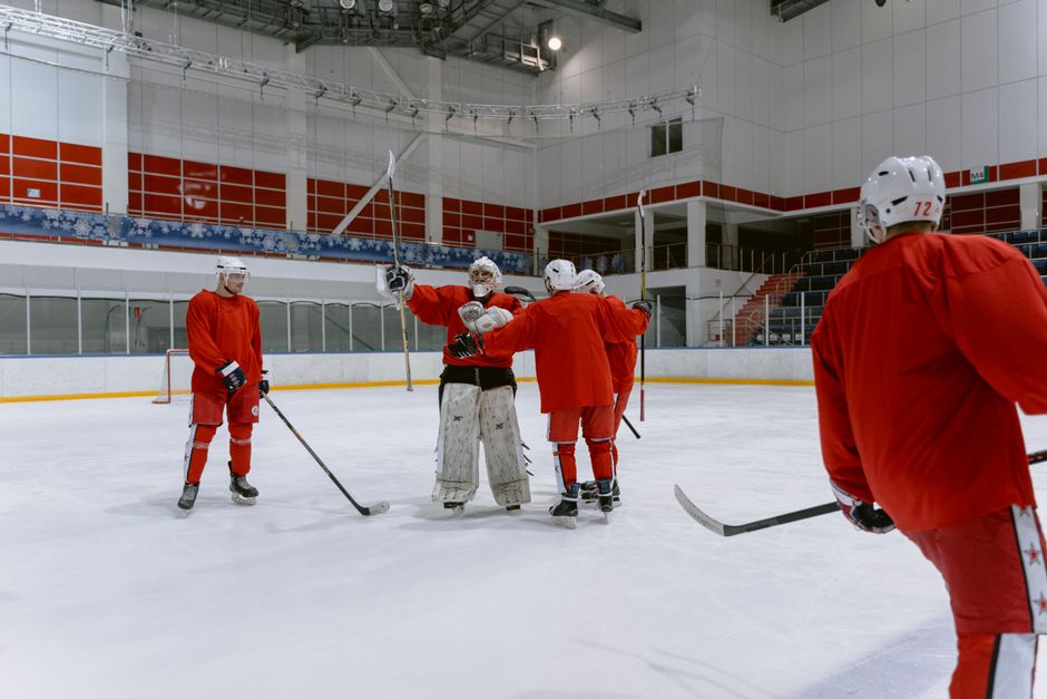 Vegas Golden Knights players huddle on ice rink