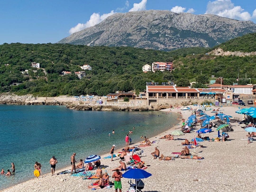 Risan Montenegro Kumbor Beach sand sea calm water