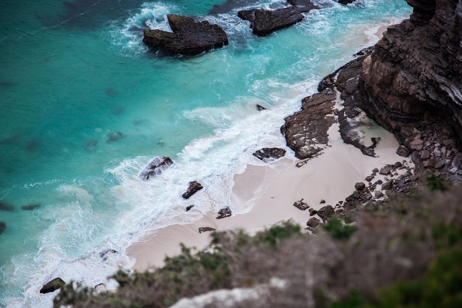 Dighna Beach white sand turquoise water cliffs Socotra