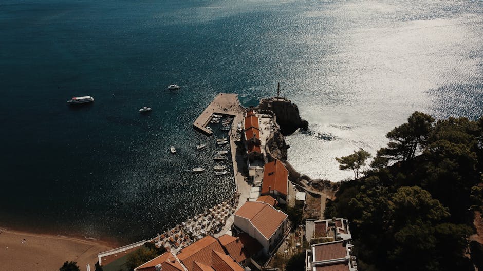 Petrovac Beach Montenegro sandy beach castle hill