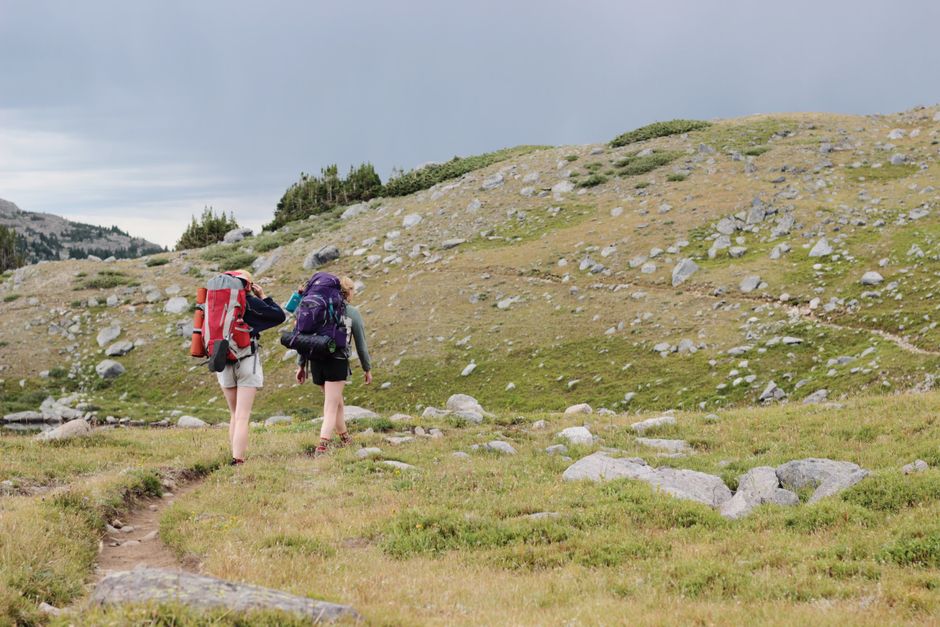 Prionia Plateau Mount Olympus Greece grassy meadow hikers backpacks