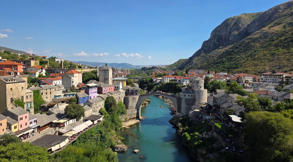 Mostar dawn empty streets Stari Most bridge mist over Neretva River