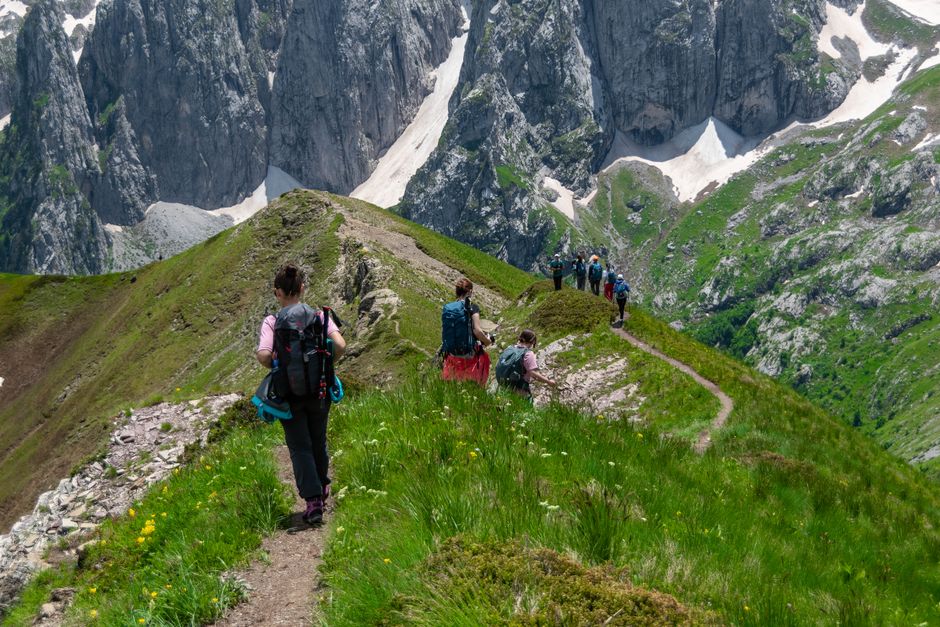 Velebit trail Croatia hikers rocky path forest