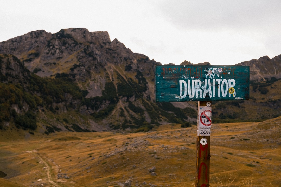Trail markers on Durmitor hiking path mountain landscape