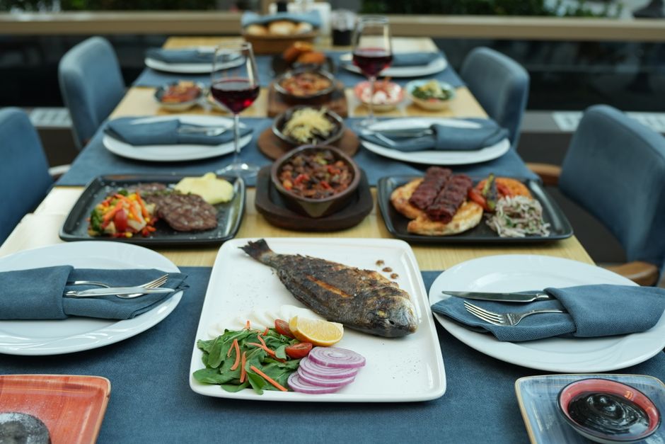 Bulgarian Black Sea cuisine grilled fish Shopska salad table