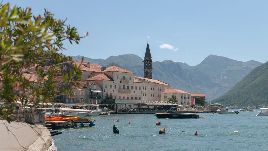 Perast town waterfront Montenegro baroque palaces sunset