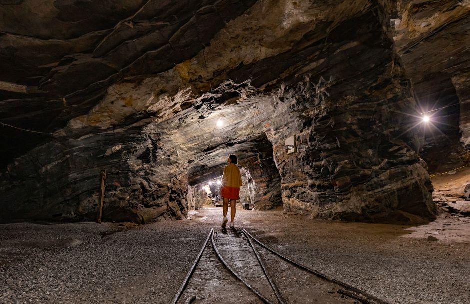 Postojna Cave Slovenia steam train emerging from limestone tunnel