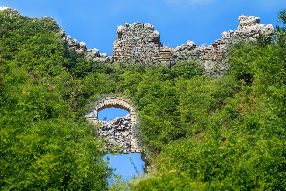 Maglič Fortress Serbia ruins steep hill Drina River valley overgrown vegetation