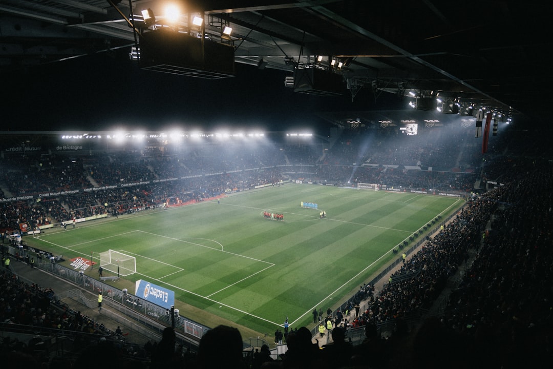 packed football stadium crowd cheering night