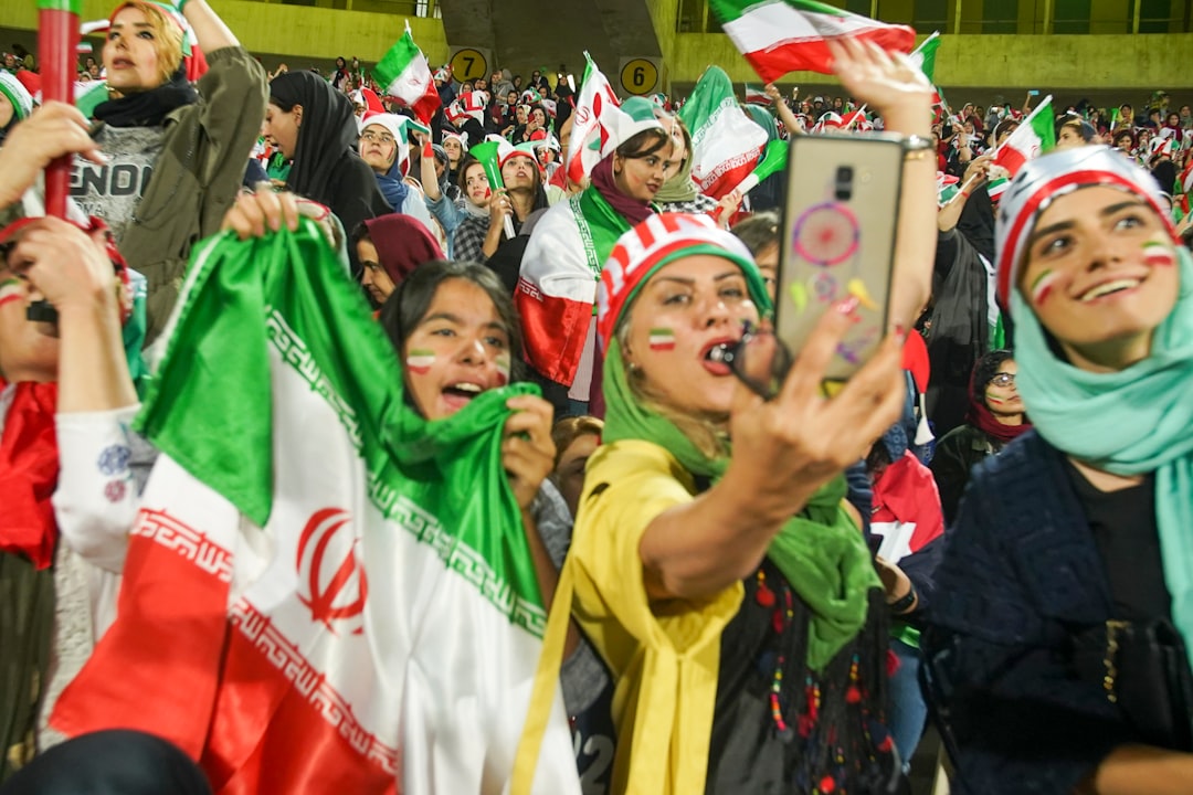 Iranian fans cheering at World Cup qualifier match