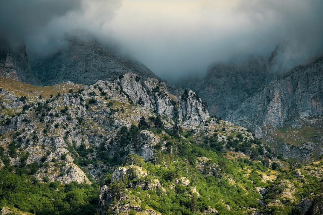 Valbona Pass Albania summit view limestone peaks clouds