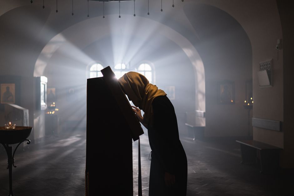 Orthodox faithful praying in Cyprus church interior