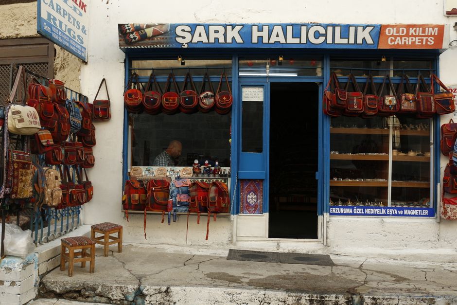 Gjirokastër Bazaar Street Albania narrow stone buildings shops leather goods
