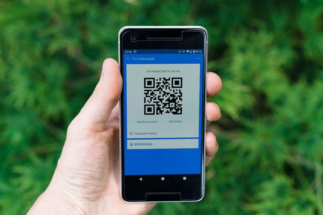 Pokemon Go player scanning QR code in park