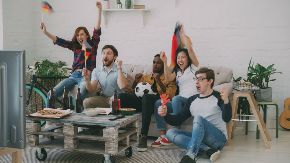 Bulgarian fans watching football match on TV