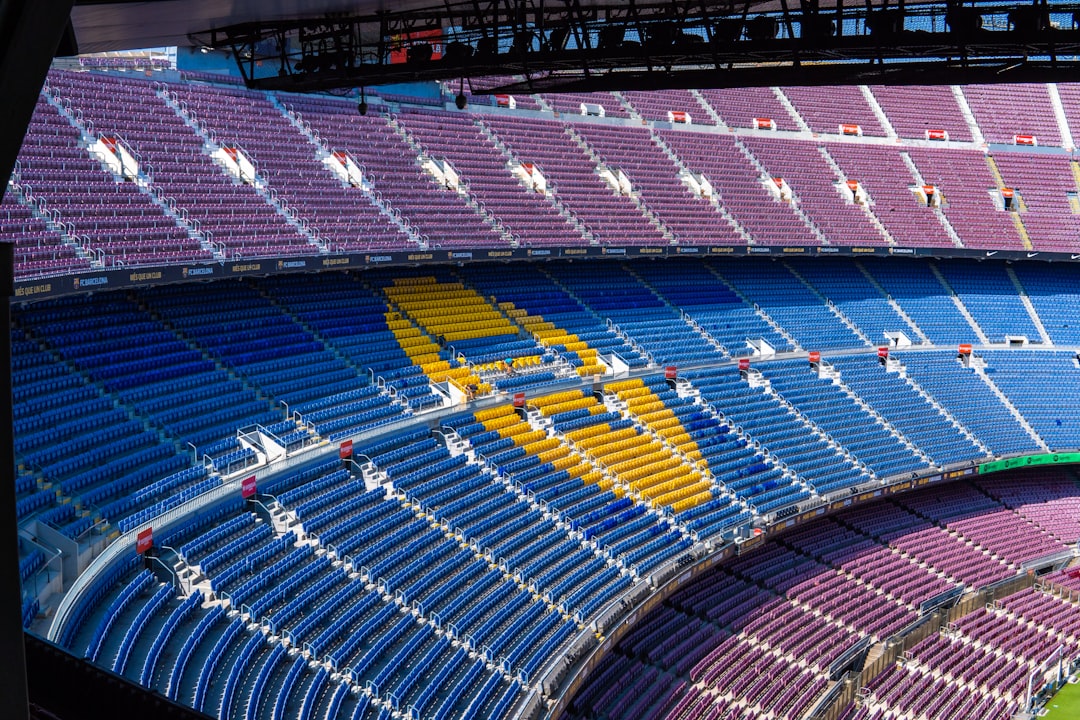 F1 fans waving flags at Barcelona grandstand