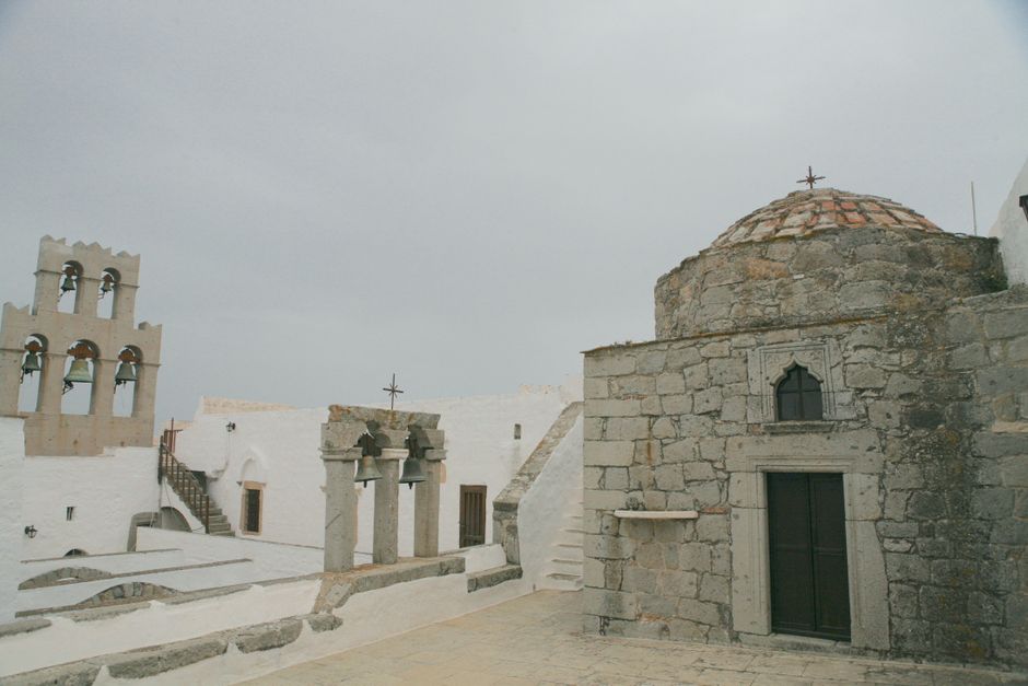 Samaria Monastery Crete Greece whitewashed building bell tower courtyard
