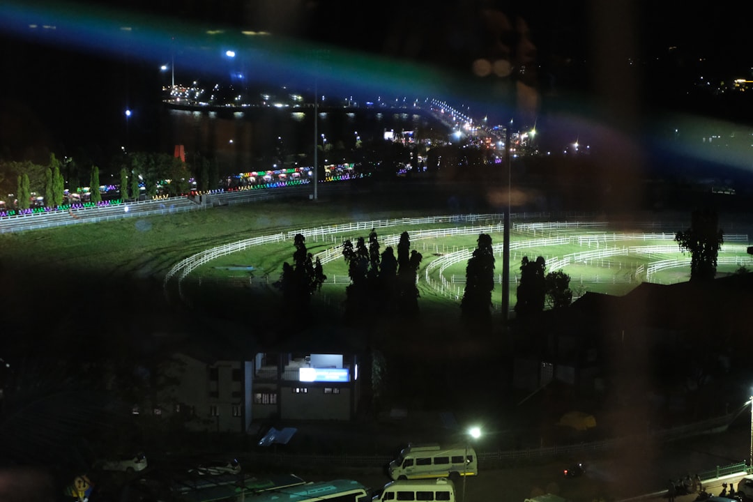crowd watching drift event at night stadium