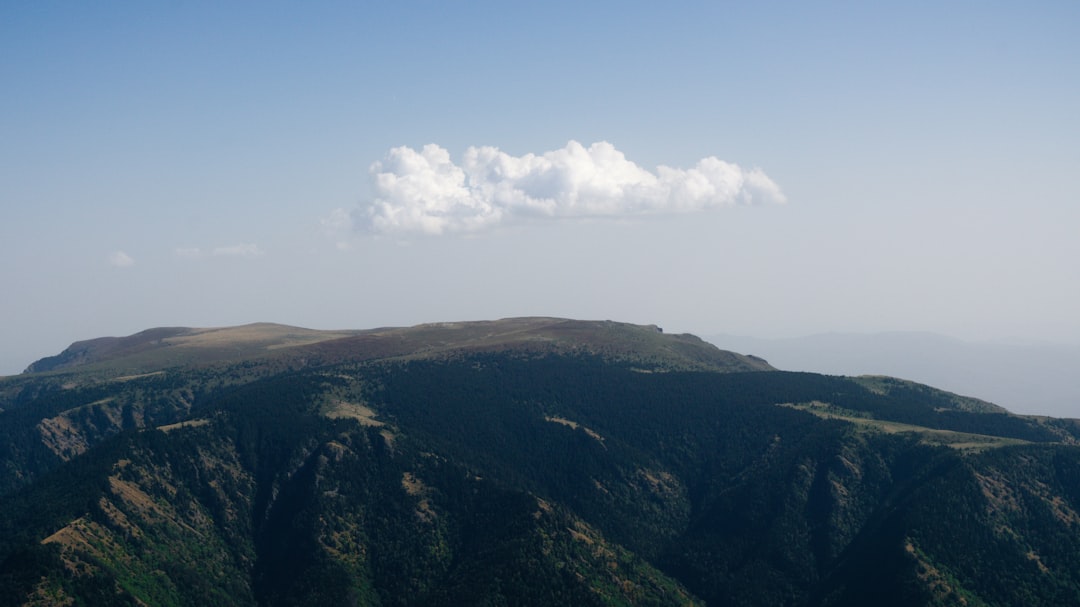Mount Musala summit cairn rocky ridge clouds Bulgaria