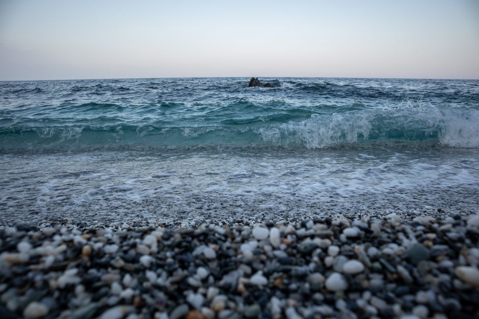 Zanjice Beach Montenegro pebble shore calm blue water trees
