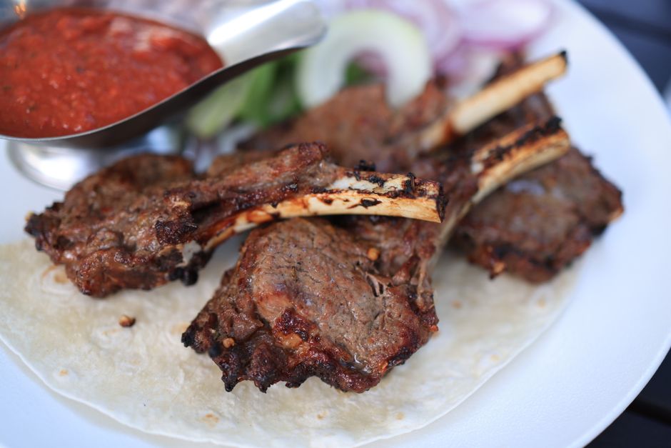 Sarajevo Cevapi grilled meat sausages flatbread onions plate